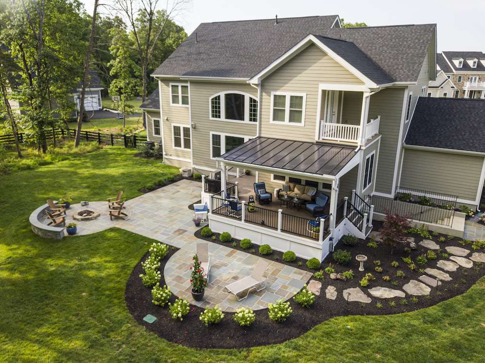 plantings around patio and deck with stone walkway