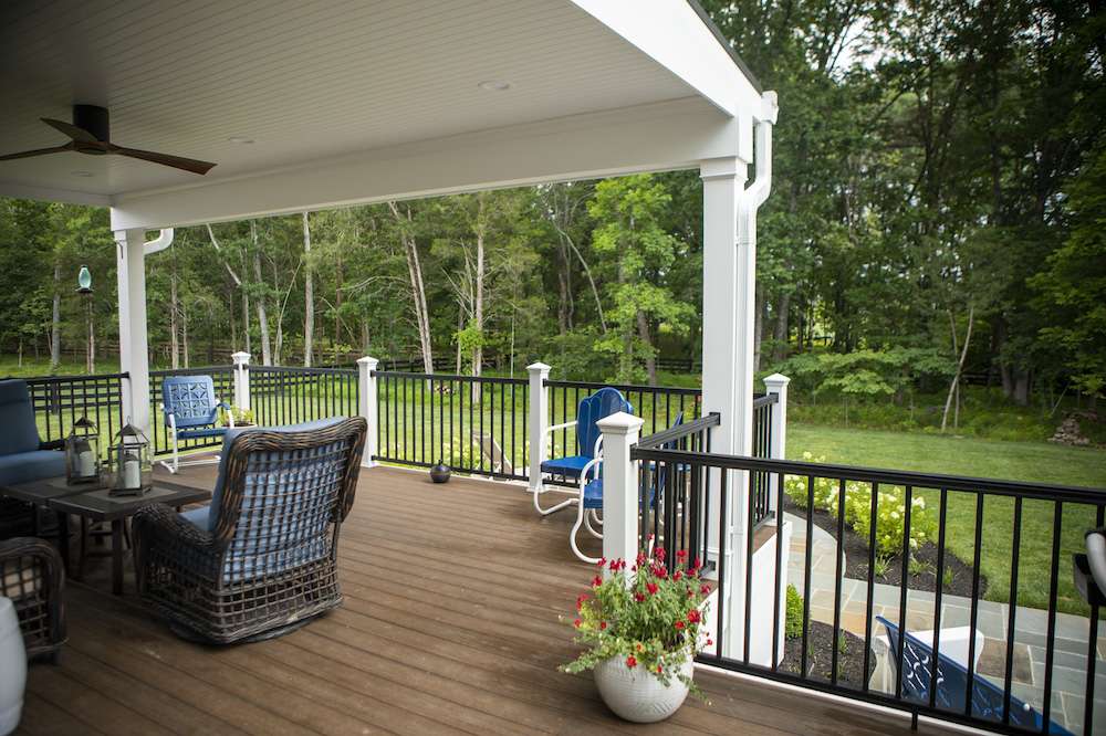 deck with metal railings and outdoor furniture