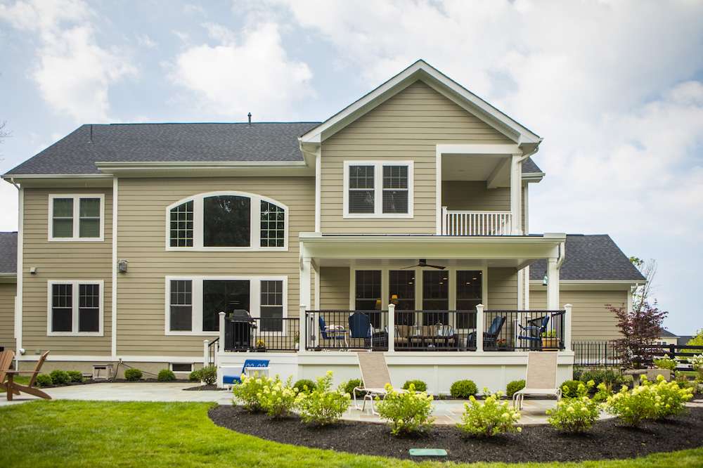 small deck attached to home with paver patio