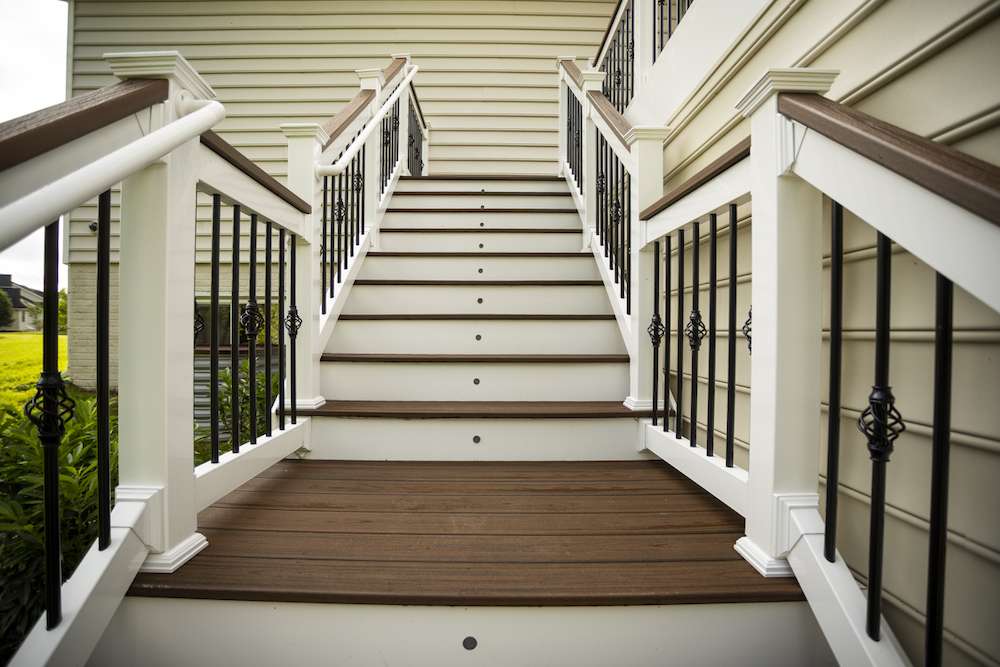 stairs and railings on new brown and white deck