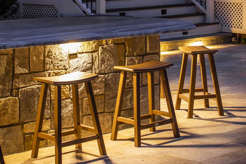 outdoor lighting under countertop of outdoor kitchen