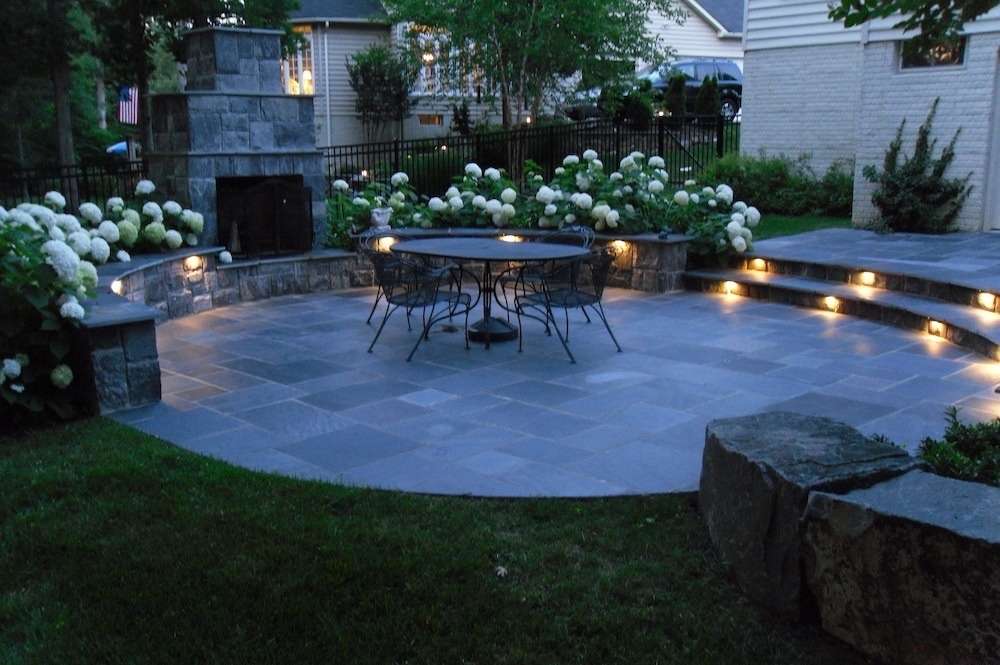 landscape lighting around patio in steps and retaining wall