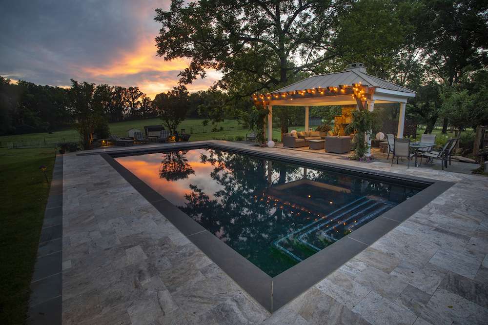 pool and pergola with landscape lighting