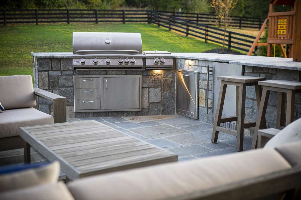 outdoor kitchen with bluestone patio