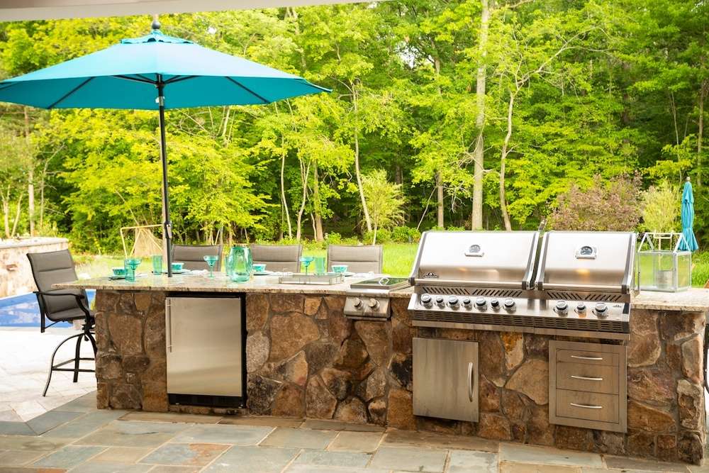 outdoor kitchen near pool 