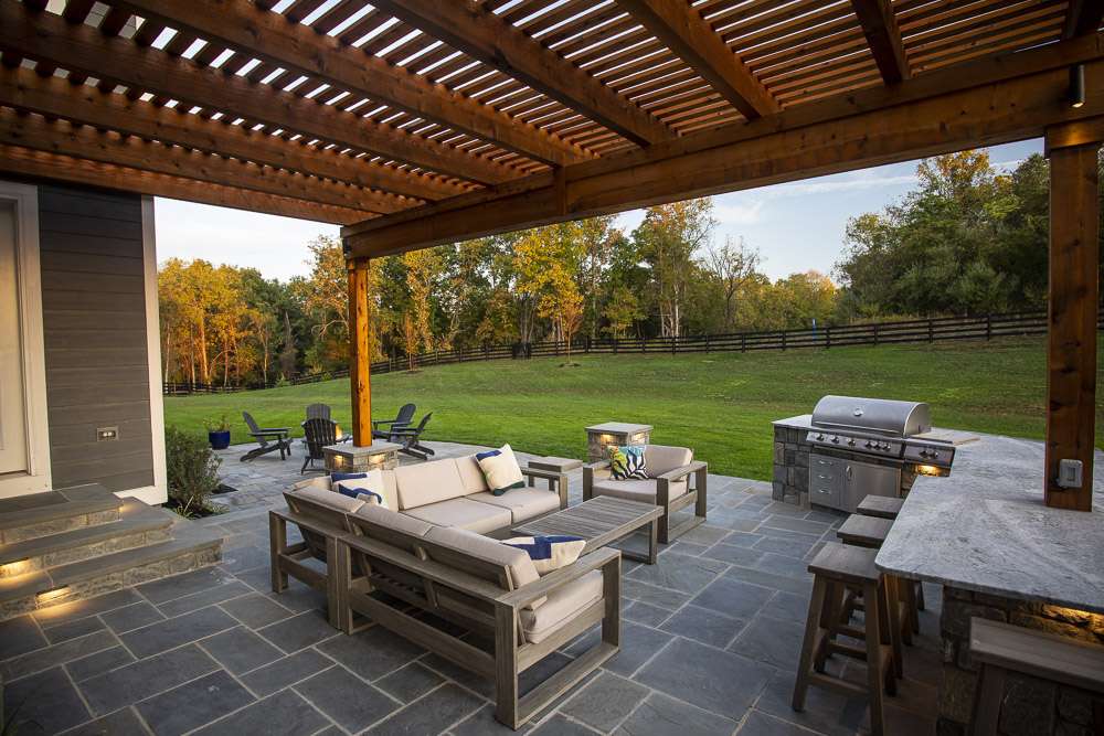 pergola with patio and outdoor kitchen