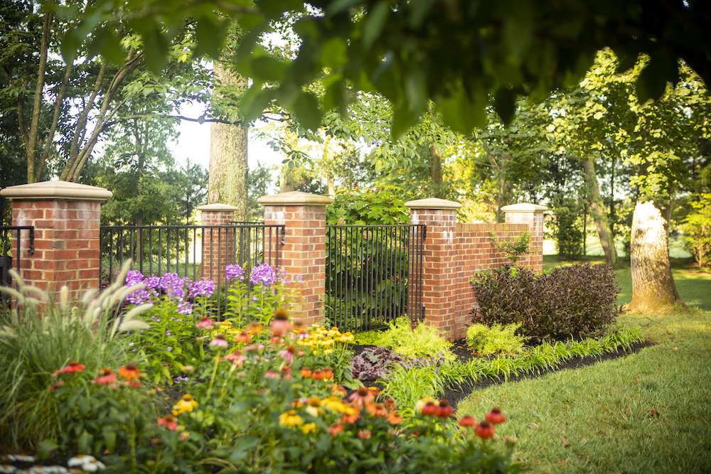 large landscape bed with perennial flowers and grasses