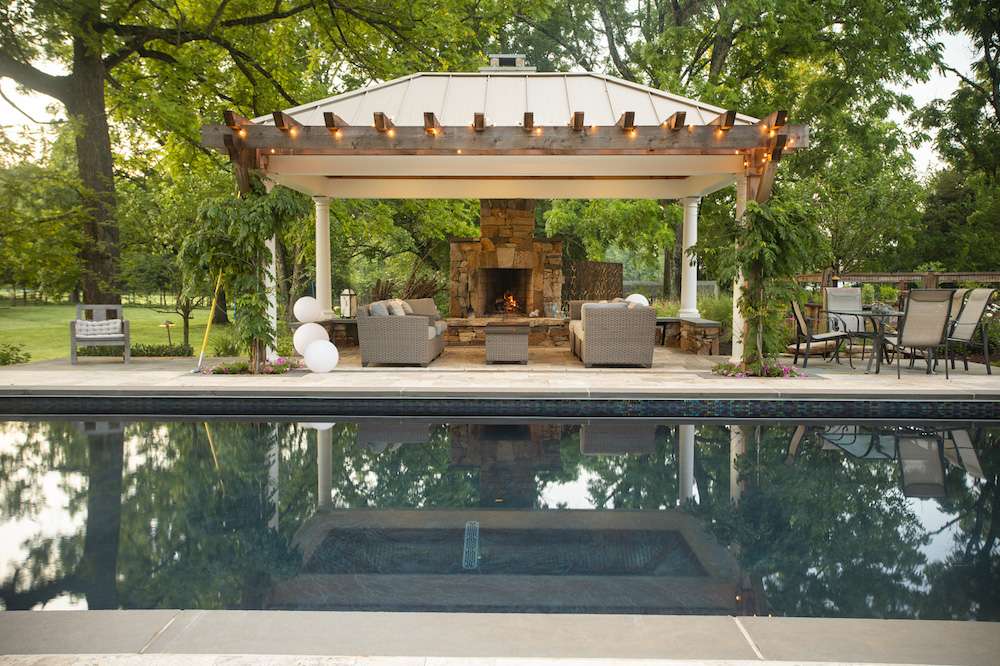 pavilion with fireplace and pool
