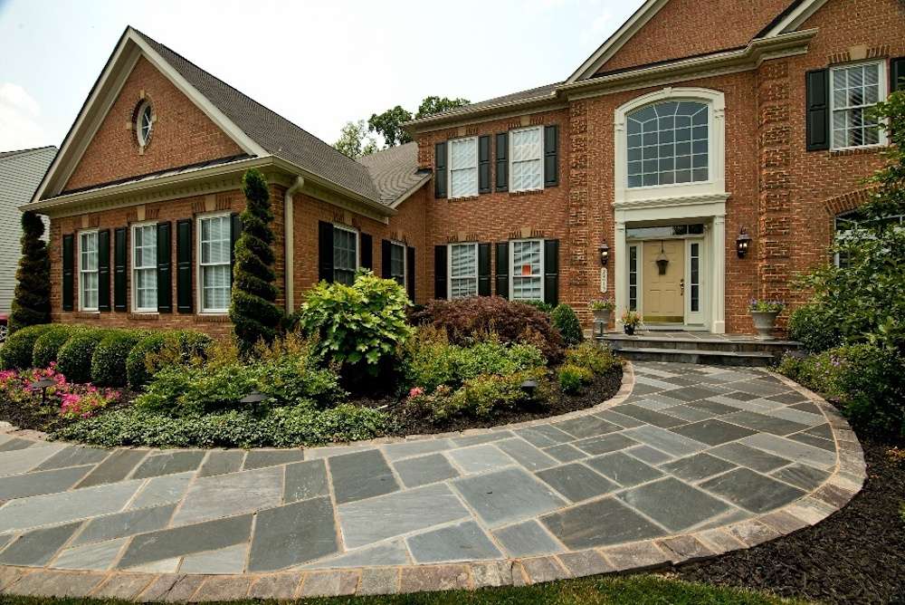 flagstone walkway with plantings in landscape beds