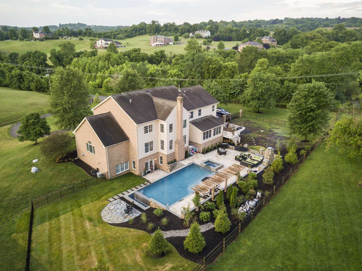 Strategically placed plants and landscape features for pool privacy