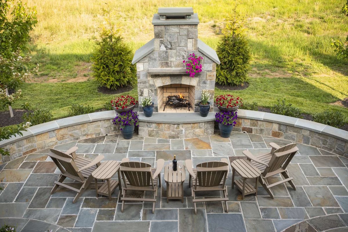 fireplace and patio with plantings and container gardens