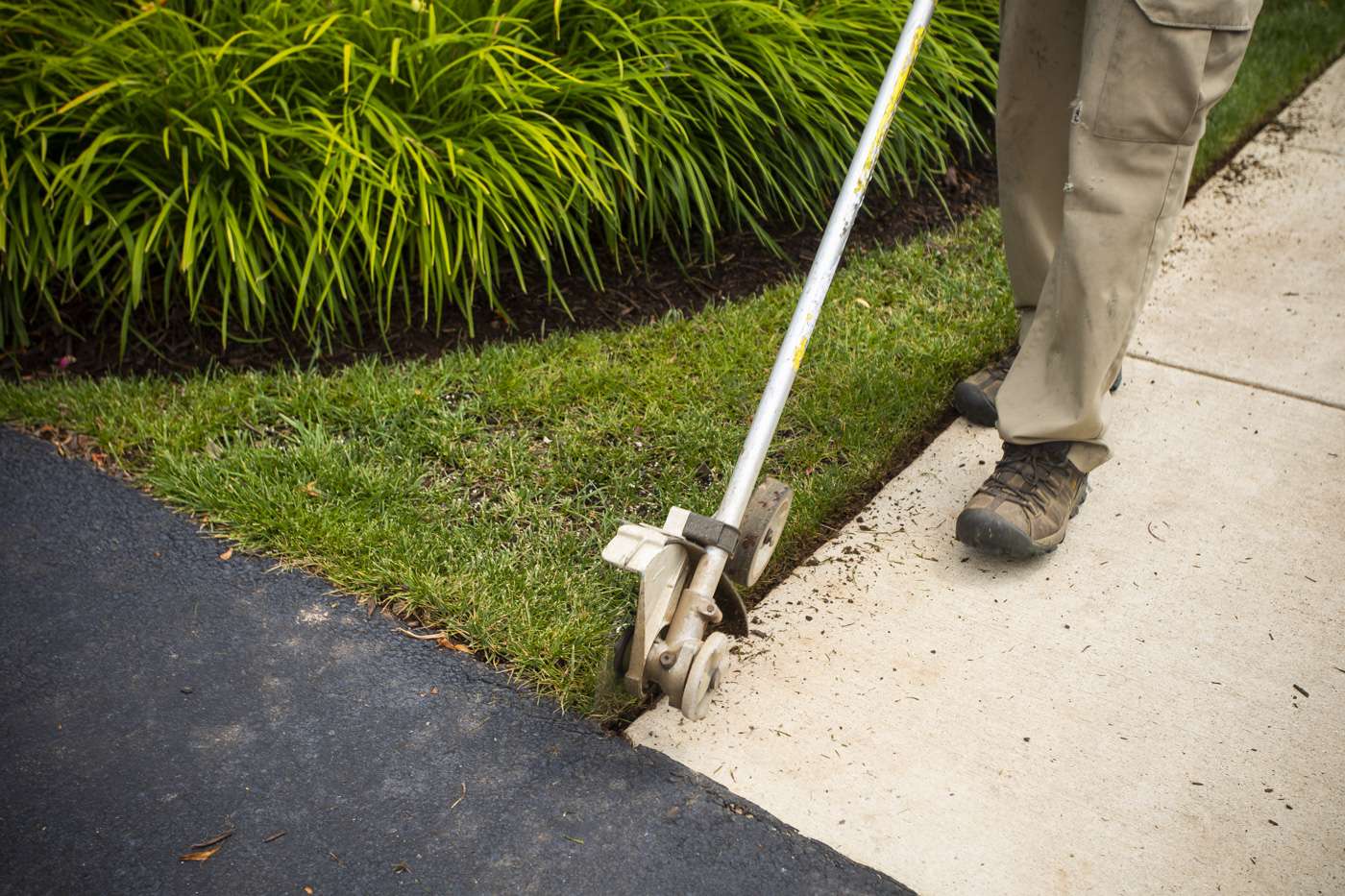 Cutting an edge into landscape beds and sidewalk