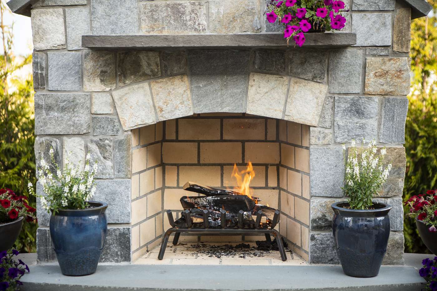 Natural stone wood burning outdoor fireplace