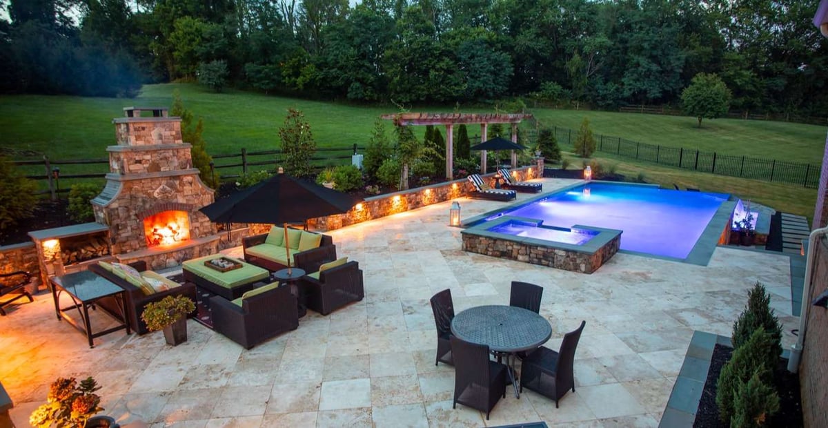 outdoor-fireplace-patio-pool-lighting-stone-wall-1