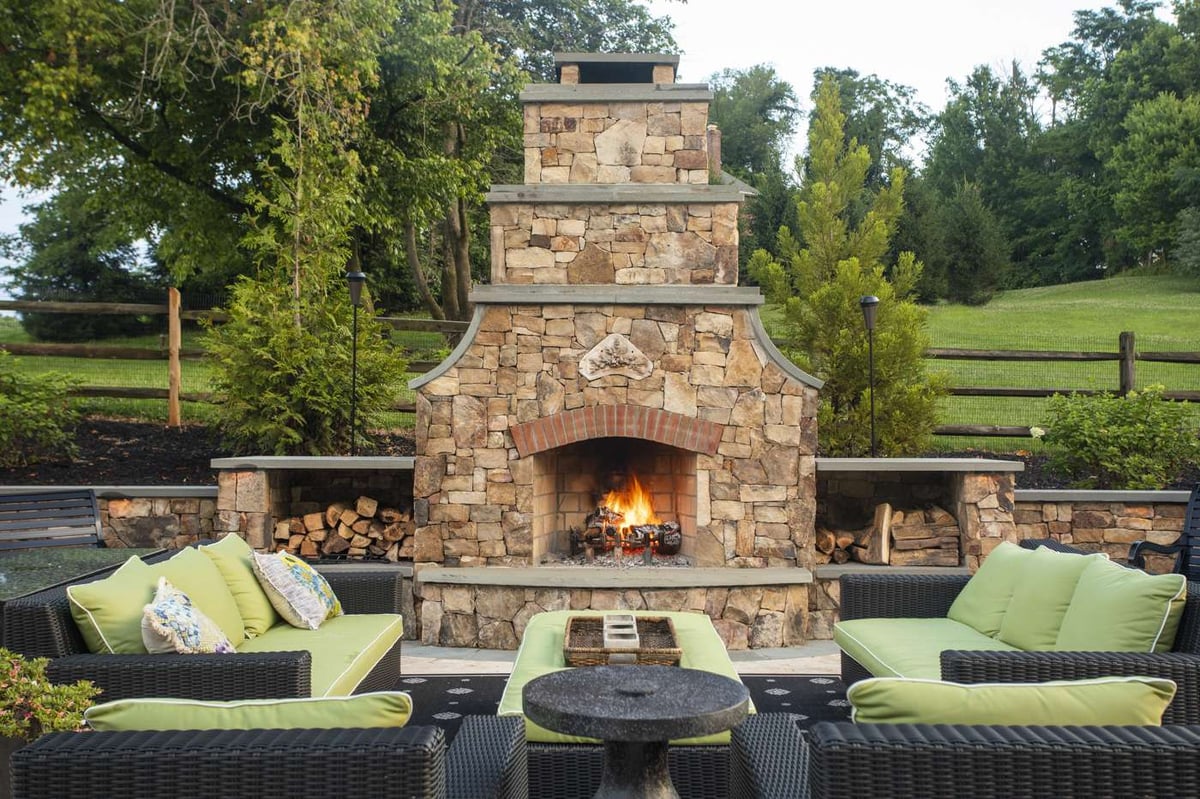outdoor fireplace with wood storage