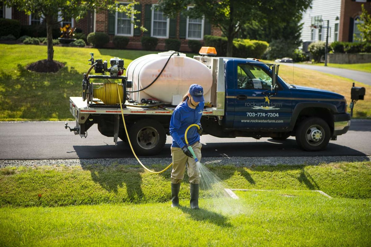 Lawn care company technician and truck