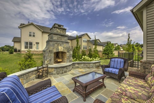Patio and outdoor fireplace in Ashburn, VA designed by Rock Water Farm