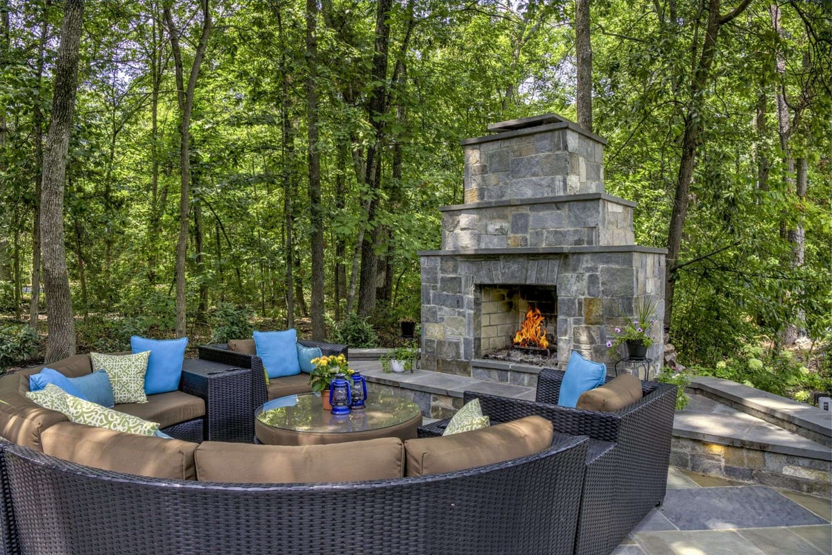 patio and outdoor fireplace with seating