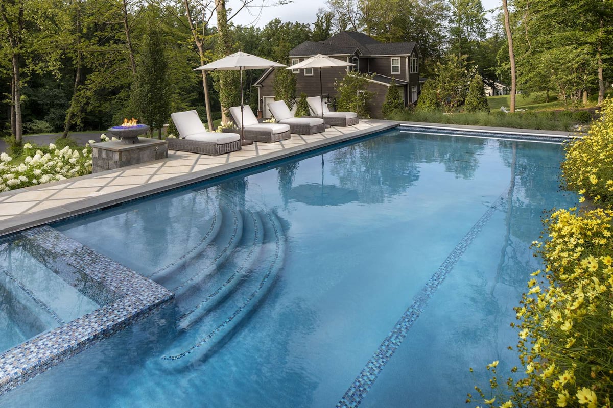 in ground pool with hot tub and fire element