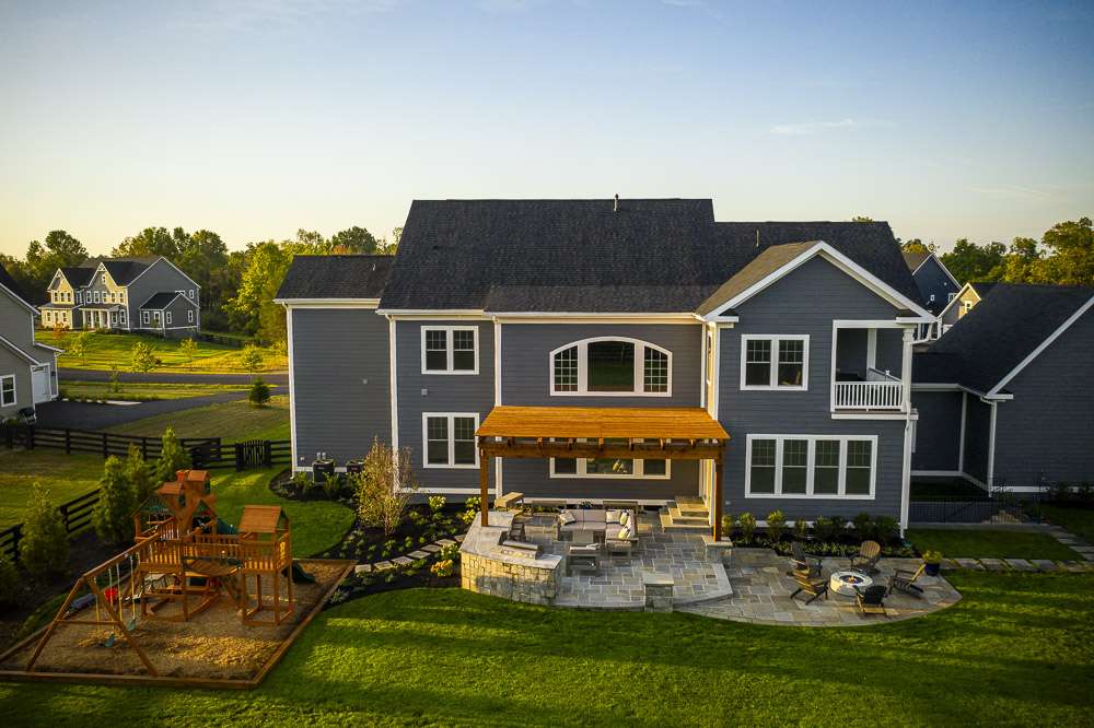 Pergola and paver patio in low maintenance landscape