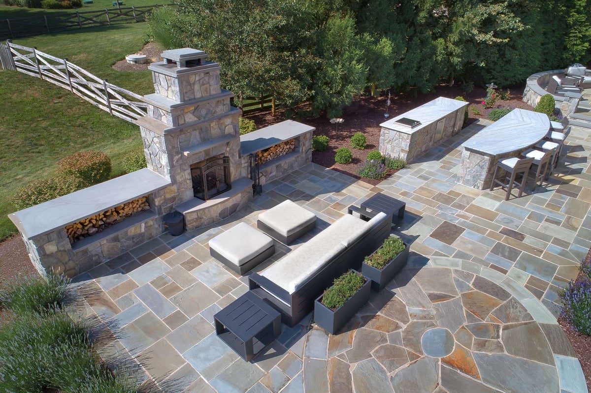 patio layout with outdoor fireplace and kitchen