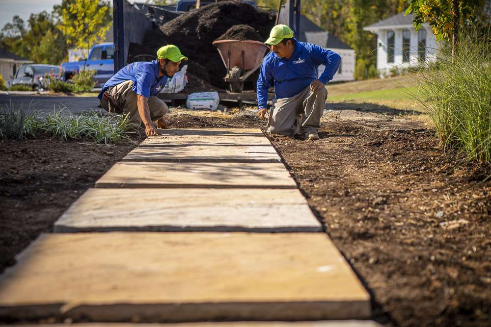 crew laying stepping stones