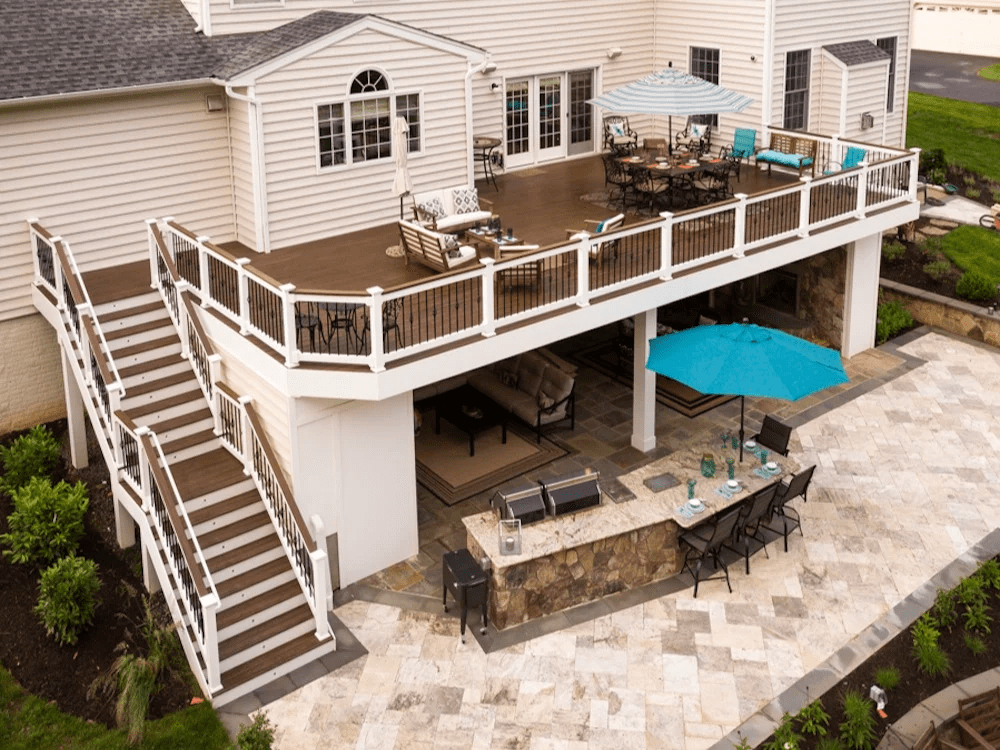 custom deck with patio and outdoor kitchen