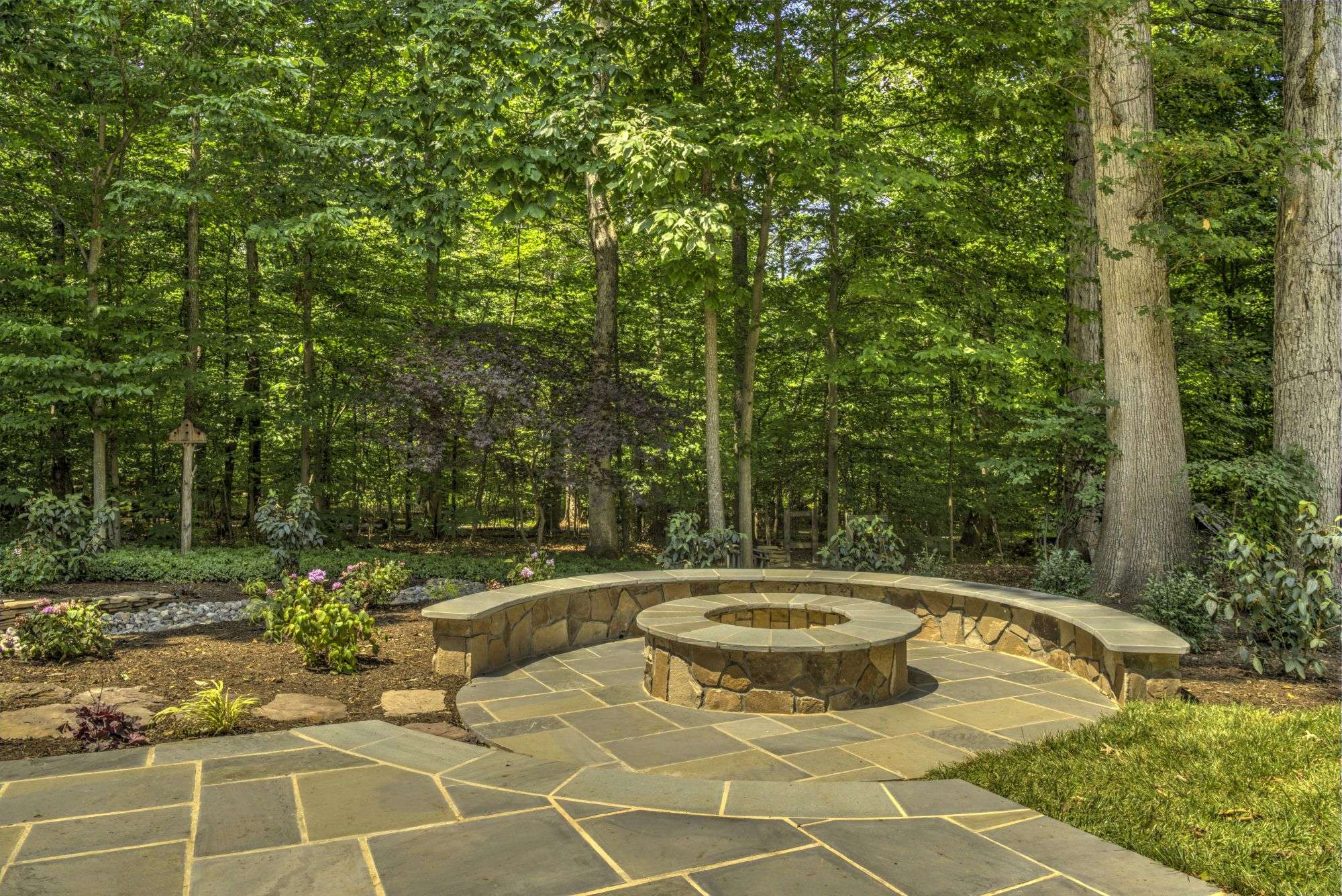 Seating wall around a fire pit for extra seating