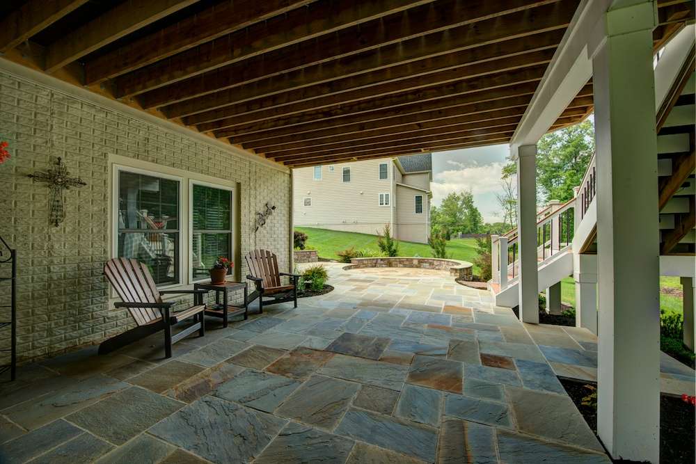 flagstone-patio-sitting-wall-under-deck