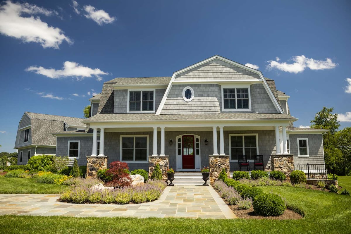 front entrance of home with walkway and plantings