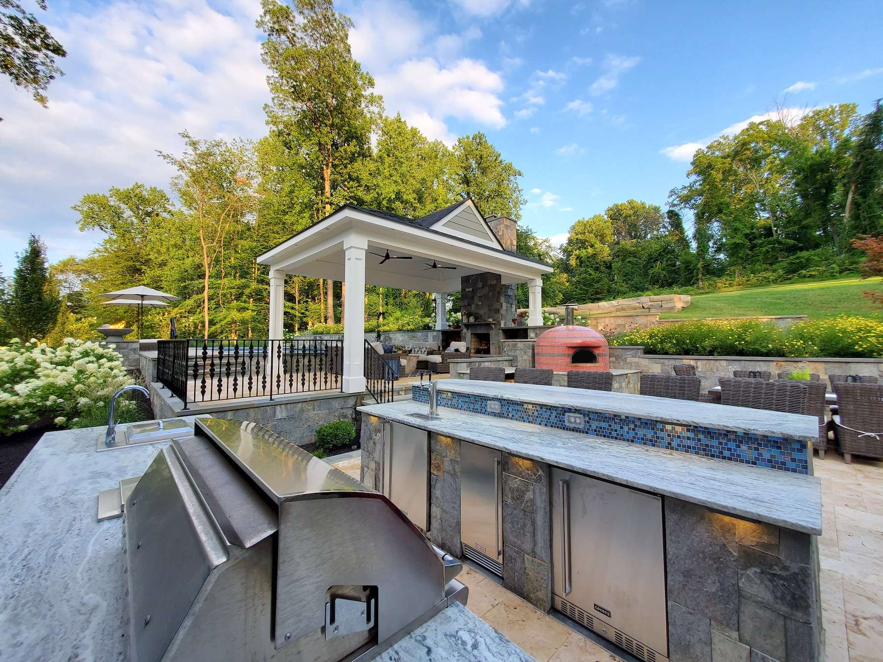 outdoor kitchen with pizza oven and pavilion