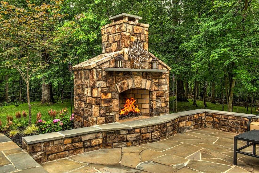 outdoor fireplace idea with seating wall