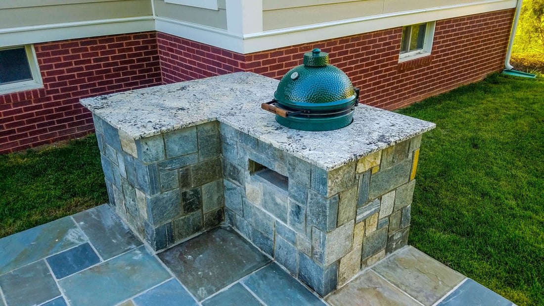 Outdoor kitchen built-in trash can and smoker