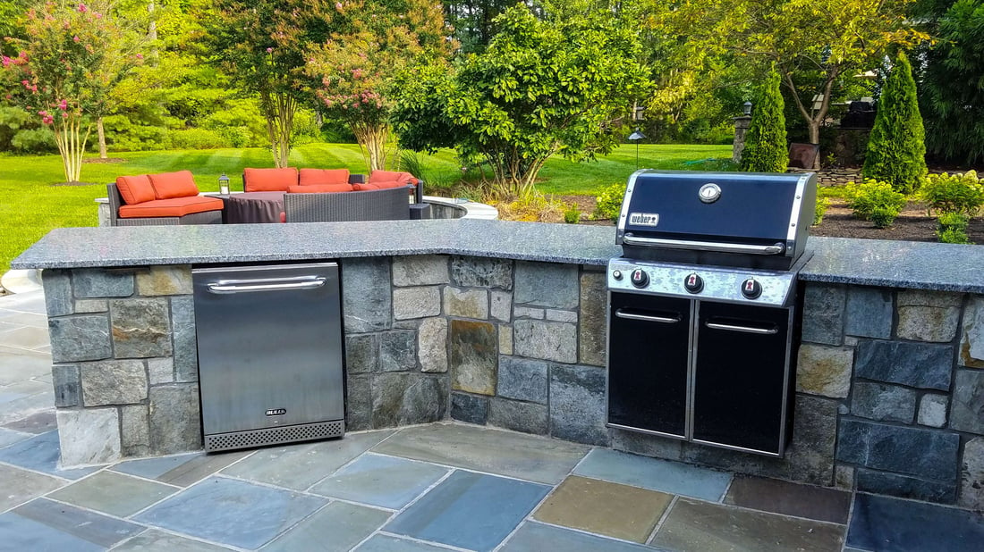 outdoor kitchen and patio with grill