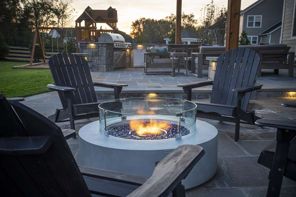 patio with gas fire pit and outdoor kitchen in Willowsford, VA