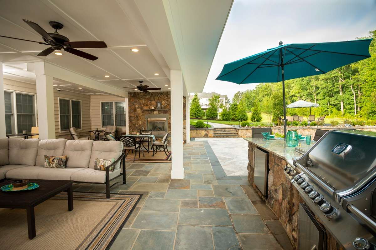 umbrella in outdoor kitchen area on bluestone patio