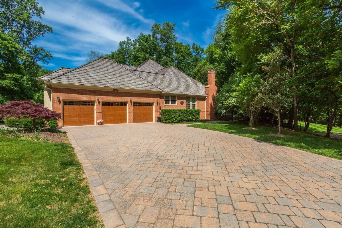 paver driveway with neat landscaping