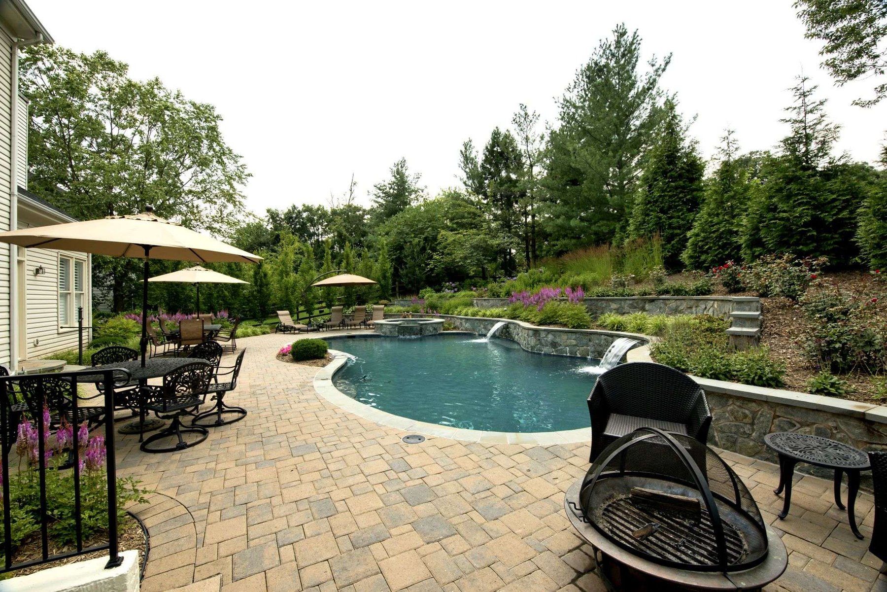 paver-patio-pool-hot-tub-waterfall