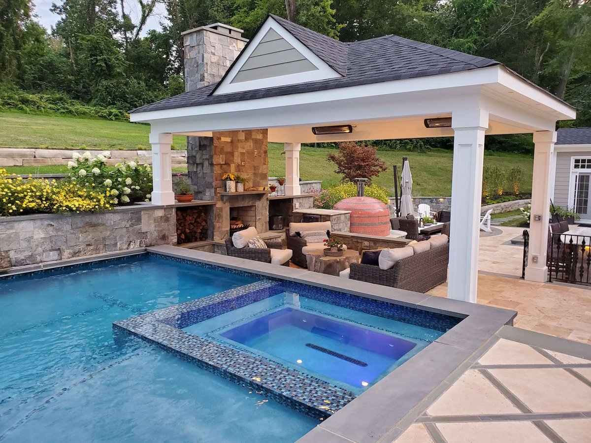 pool redesign with hot tub and pavilion with seating area and fireplace