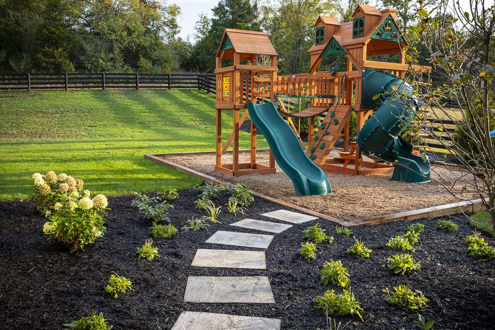 Outside children's playset and stepping stones