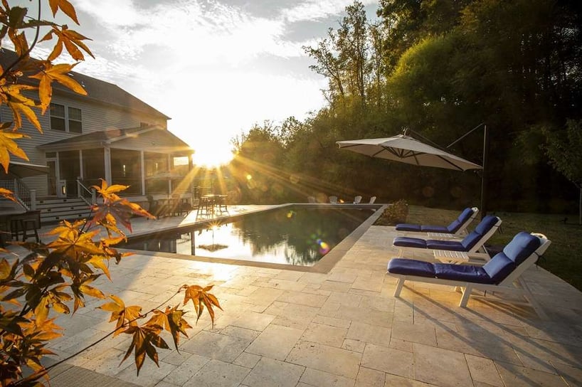 pool with natural stone patio