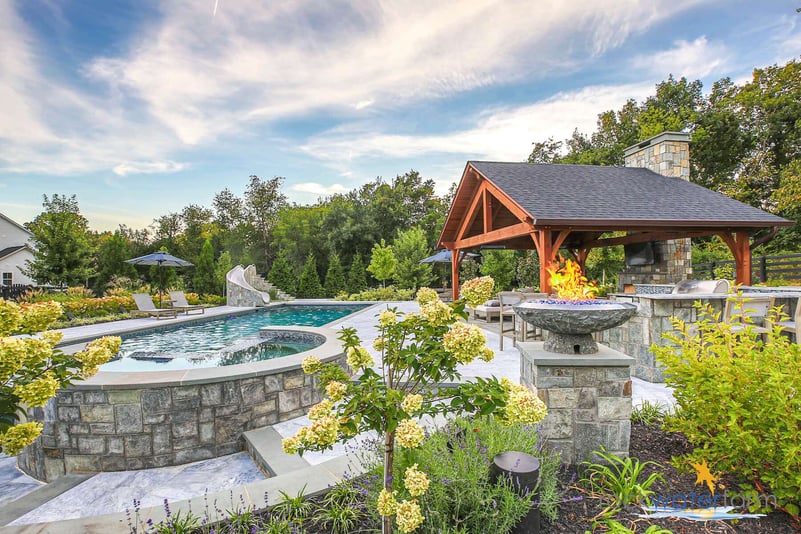 pool with spill over spa and fire bowl