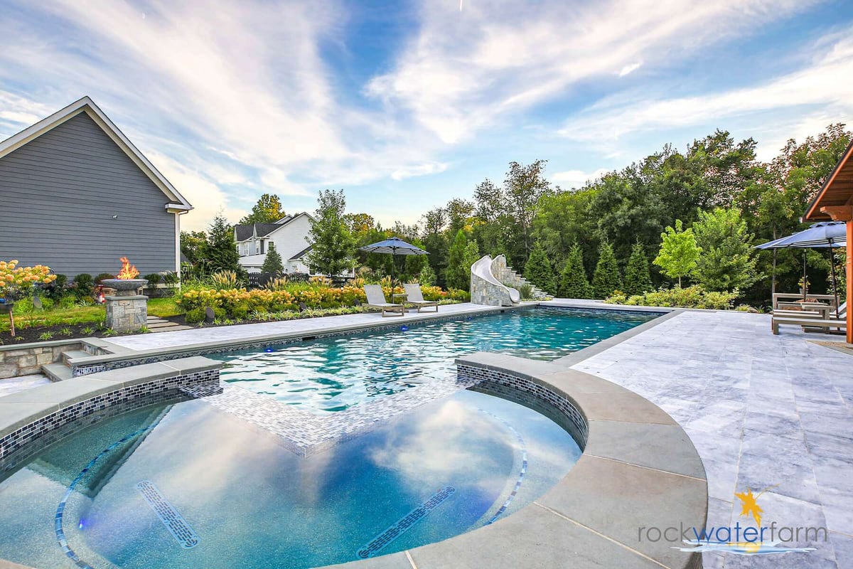 saltwater pool and hot tub with slide