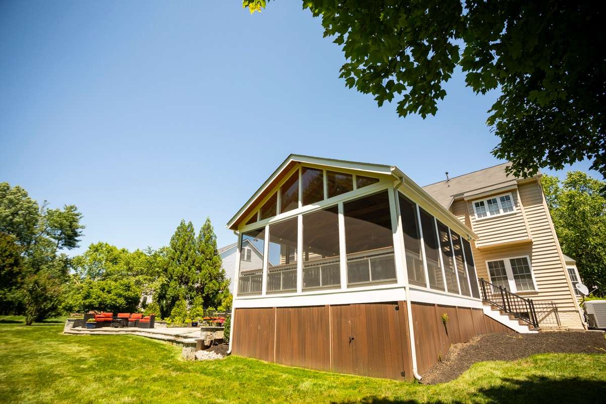 deck with screening and outdoor patio area