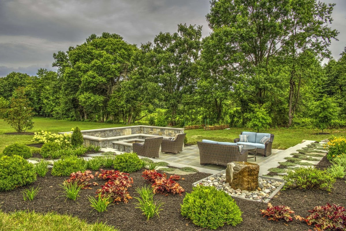 plantings with fountain patio and firepit