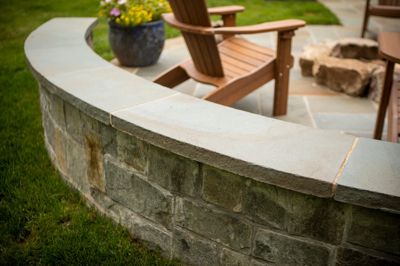 small retaining wall on edge of patio