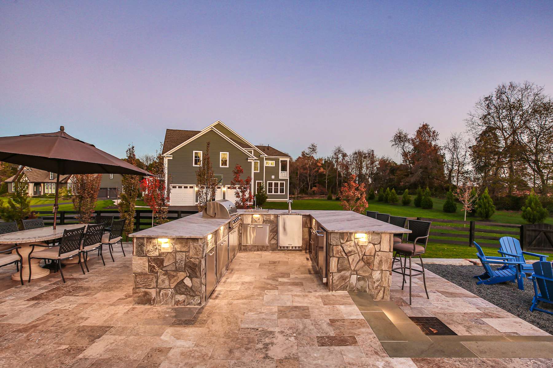 large outdoor kitchen with seating area