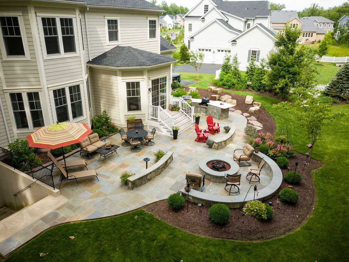 outdoor kitchen with patio and fire pit