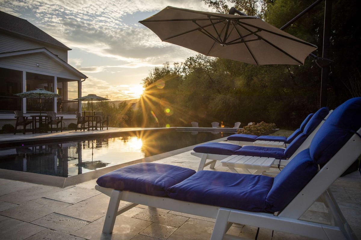 custom pool with seating area at sunset
