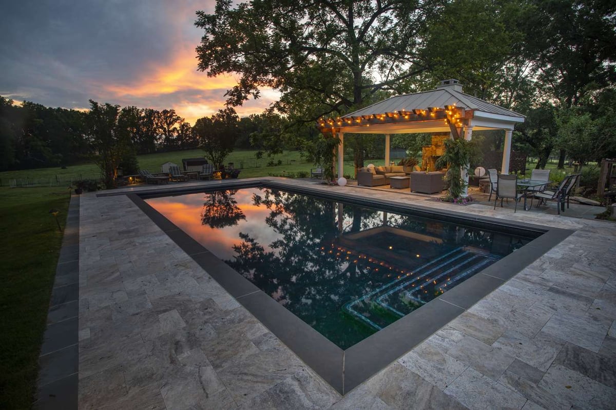 pool with pavilion and fireplace